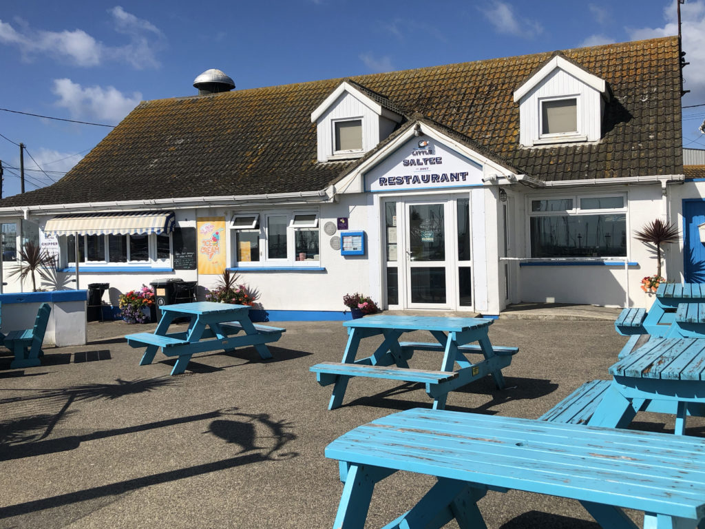 Enjoy the Summer sunshine at one of our blue tables!